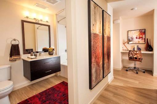 Hallway with a built in desk space and view of the bathroom at Annadel best apartments in Santa Rosa, CA.