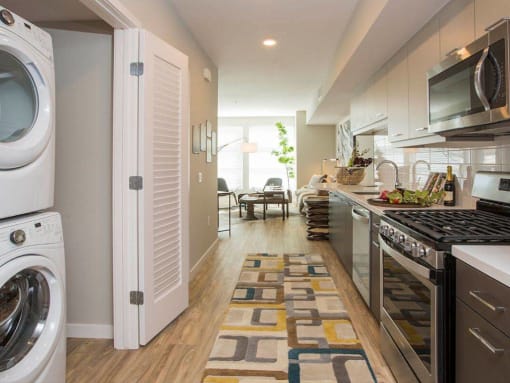 Model Kitchen to Living Room at AV8 Apartments in San Diego, CA