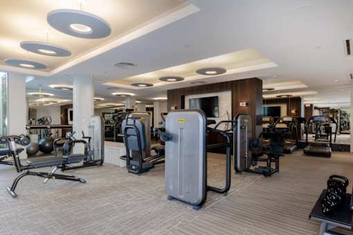 A fitness center with a variety of machines.