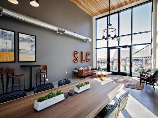 Recreation room with tables and lounge seating areas