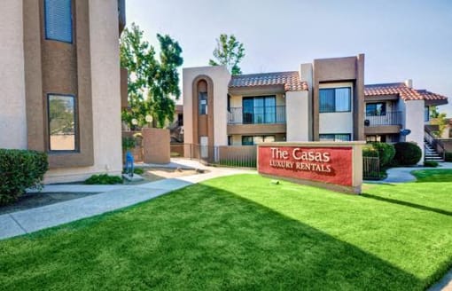 The Casas Luxury Rentals sign is in front of a building at The Casas Apartments, San Diego, CA