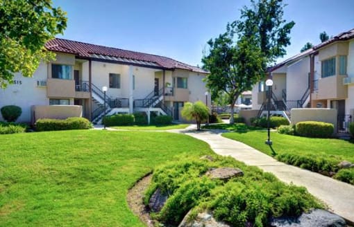 A sunny day at apartment complex with a clear blue sky at The Casas Apartments, San Diego, 92126