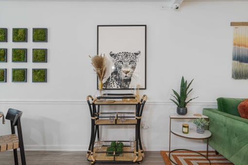 a home office with a desk and a leopard on the wall