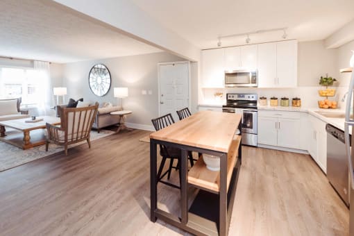 an open floor plan with a kitchen and living room