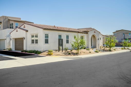 a house with a driveway and a street in front of it