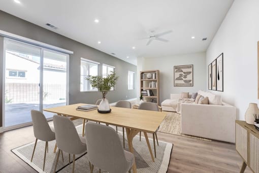 a dining room with a table and chairs