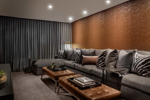a living room with a couch and tables