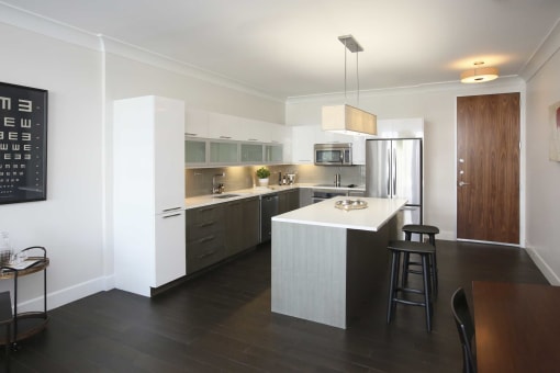 a kitchen with a white counter top and