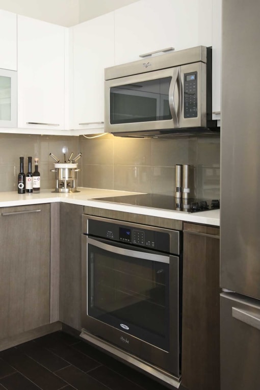 a kitchen with a microwave and a stove and a refrigerator
