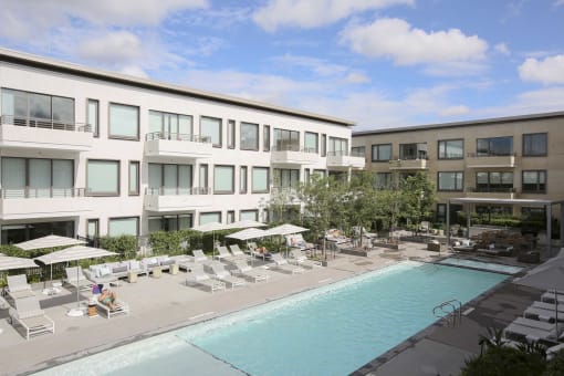 a swimming pool in front of a building