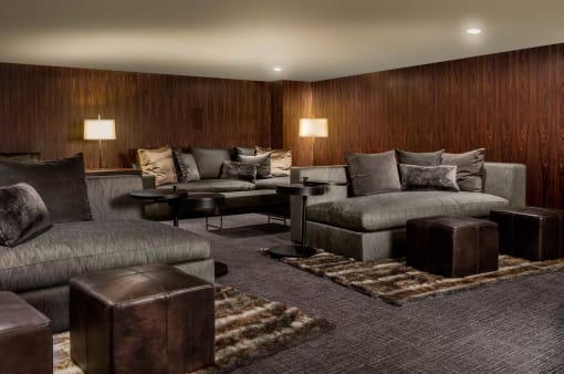 a living room with couches and chairs and tables
