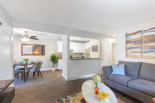 a living room and dining room with a couch and a table