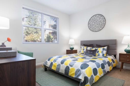 a bedroom with a bed and a window