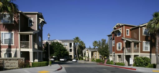 a row of town houses on the side of a street