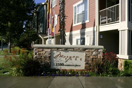 the sign in front of an apartment building
