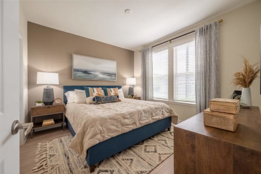 a bedroom with a large bed and a window