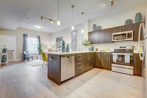 Open concept living space with kitchen at Incline at Anthem luxury apartments in Herriman
