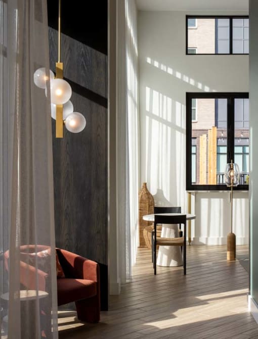 Clubroom with sunny windows at Alta Davis, Durham, NC