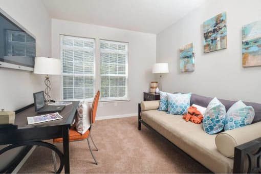a living room with a couch and a table