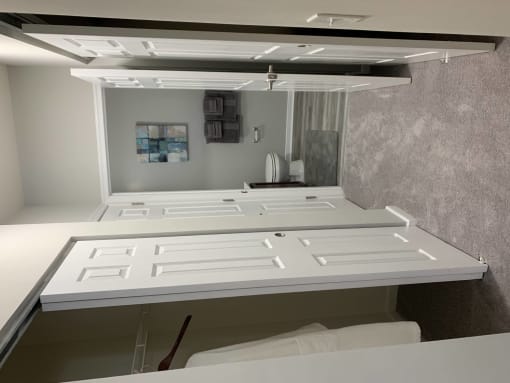 a view of a room with a mirrored ceiling