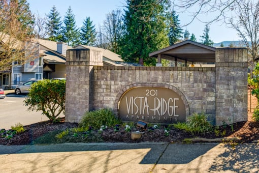 the entrance to the vista ridge apartments sign in front of the building