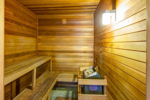 a large sauna with a bench and a table