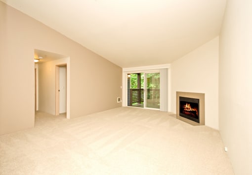 a living room with a fireplace and a window