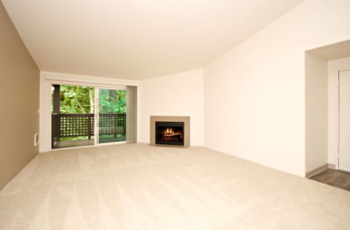 a living room with a fireplace and a window