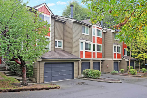 the view of a apartment building with a garage door