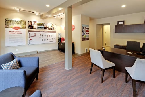 a living room and dining room with a table and chairs