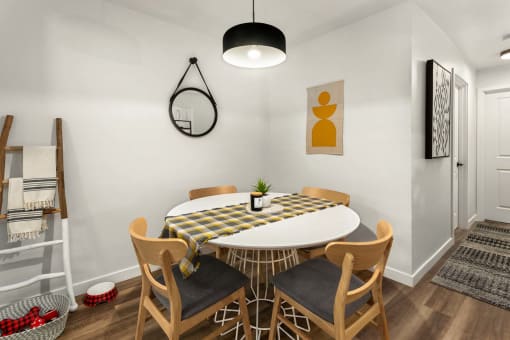 a dining room with a table and chairs