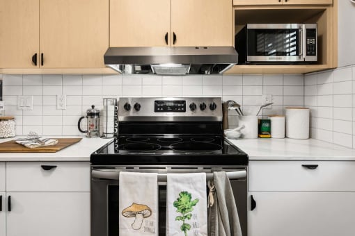 a kitchen with a stove and a microwave