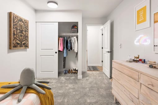 a bedroom with a closet and a bed and a chair