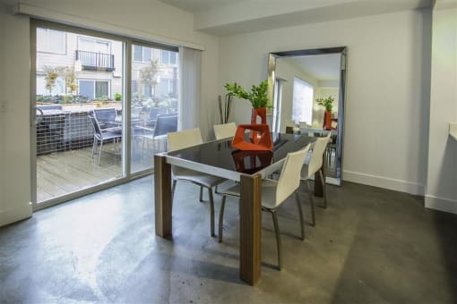 a dining room with a table and chairs