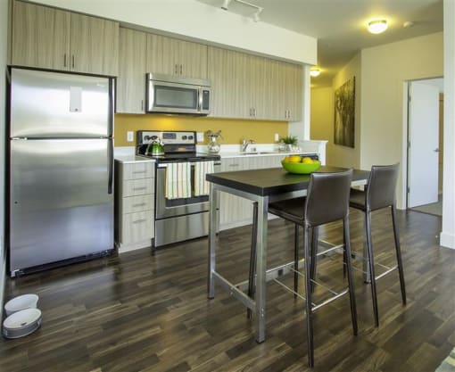 a kitchen with a table and chairs