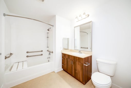 a bathroom with a toilet sink and a shower