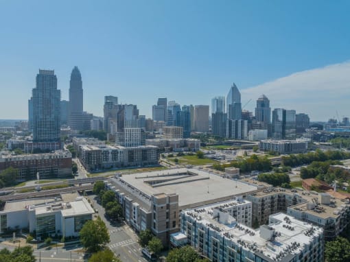 an aerial view of the city with buildings and skyscrapers