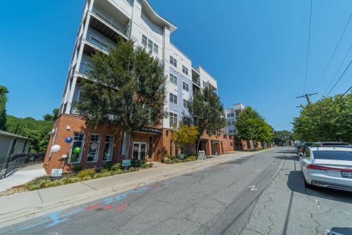 a street view of an apartment building on a city street