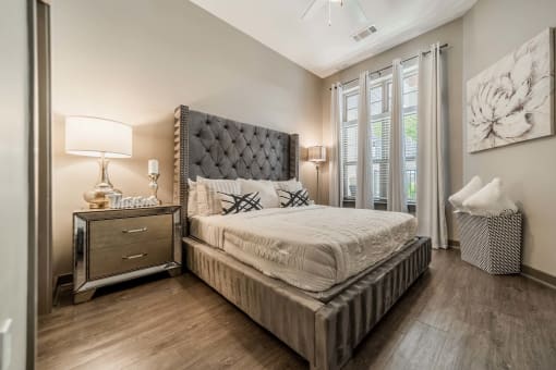 a bedroom with a bed and a window