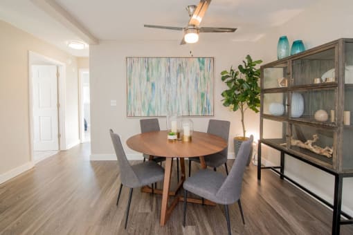a dining room with a table and chairs
