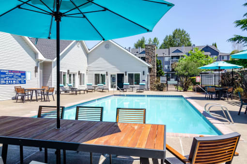 our apartments offer a swimming pool with tables and umbrellas