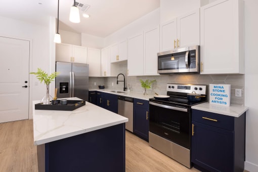 model apartment kitchen with cabinets and quartz countertops at Element 12 Apartments, Henderson NV