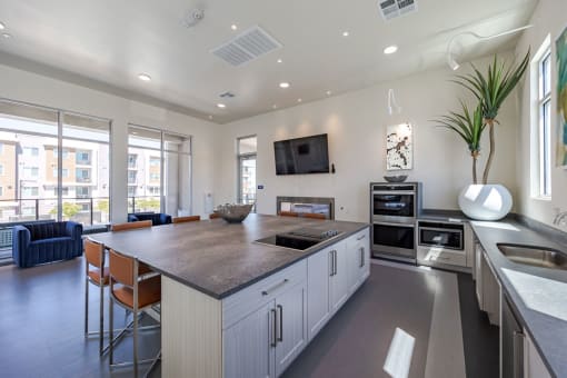 a large kitchen with a large island and a living room at Element 12 Apartments, Henderson NV
