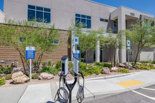 an electric vehicle charging station in front of a building at Element 12 Apartments, Henderson NV