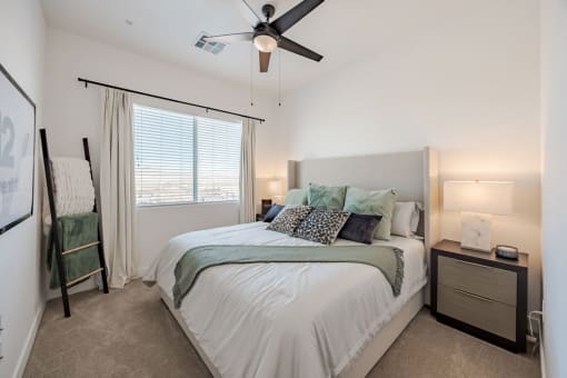 a bedroom with a bed and a ceiling fan at Element 12 Apartments, Henderson NV