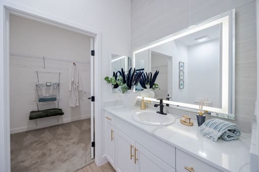 a bathroom with a sink and a mirrorat Element 12 Apartments, Henderson NV
