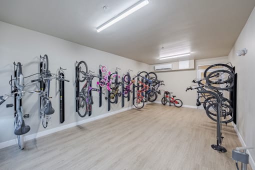 a room with many bikes hanging on the wall at Element 12 Apartments, Henderson NV