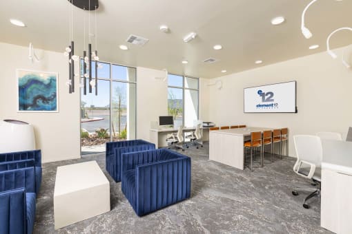 a seating area with couches and chairs at Element 12 Apartments, Henderson NV