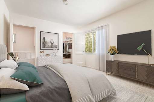 a bedroom with a bed and a tv at Hillsdale Garden Apartments, California