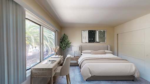 A bedroom with two beds and a desk with a chair at Hillsdale Garden Apartments, San Mateo, CA 94403